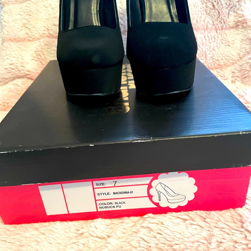 Gently loved, black velvet heels.